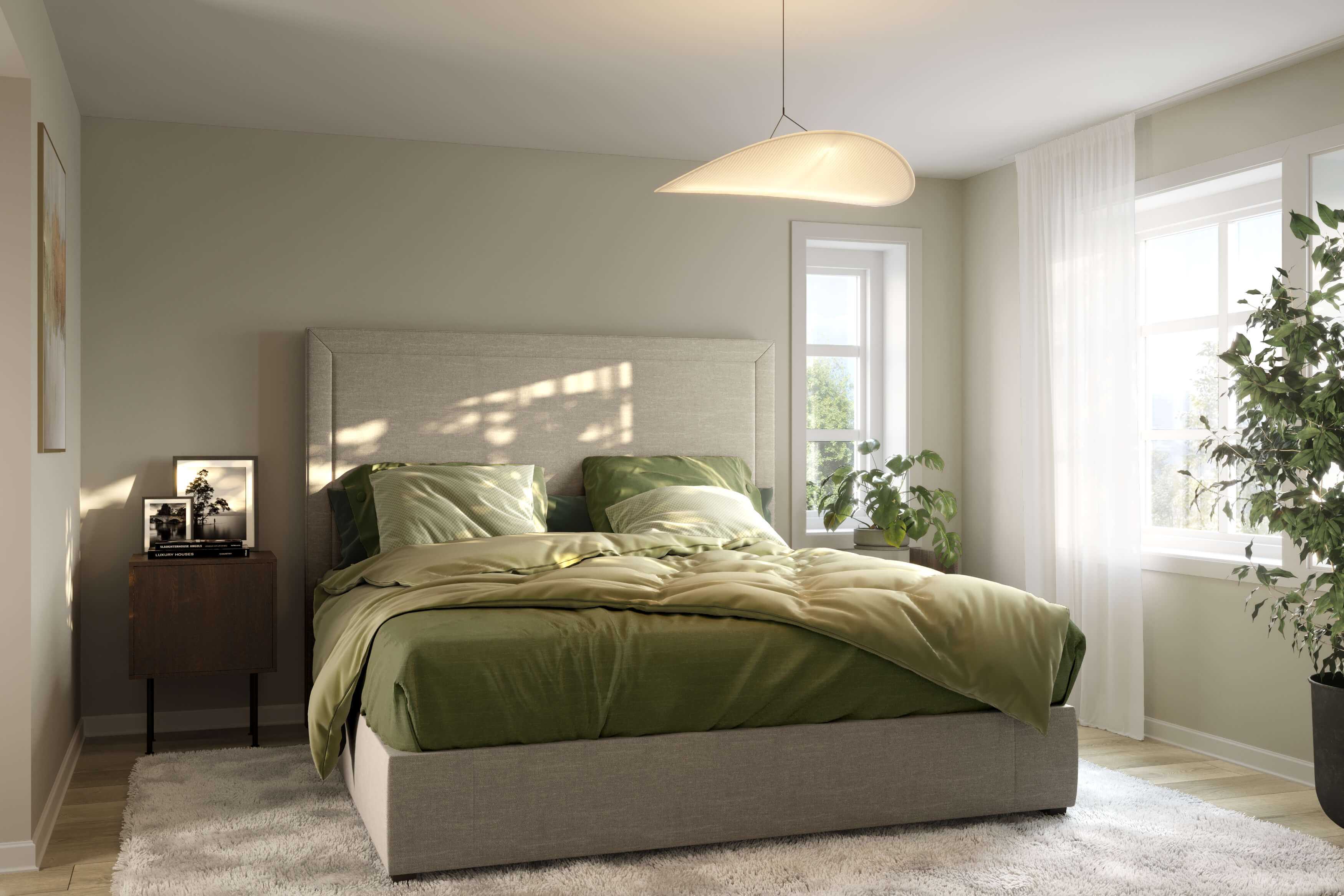 Hovedsoverommet i husmodellen Adele fra ABChus med flott grønt sengetøy som gjør rommet lunt og godt
